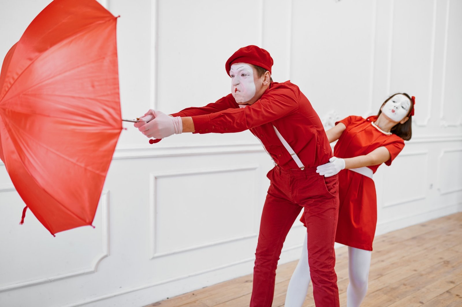 Mime artists, scene with umbrella in windy weather